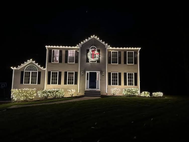 Wreath centered, windows framed &mdash; Christmas light installation by Mike&rsquo;s Cincinnati Christmas Lights